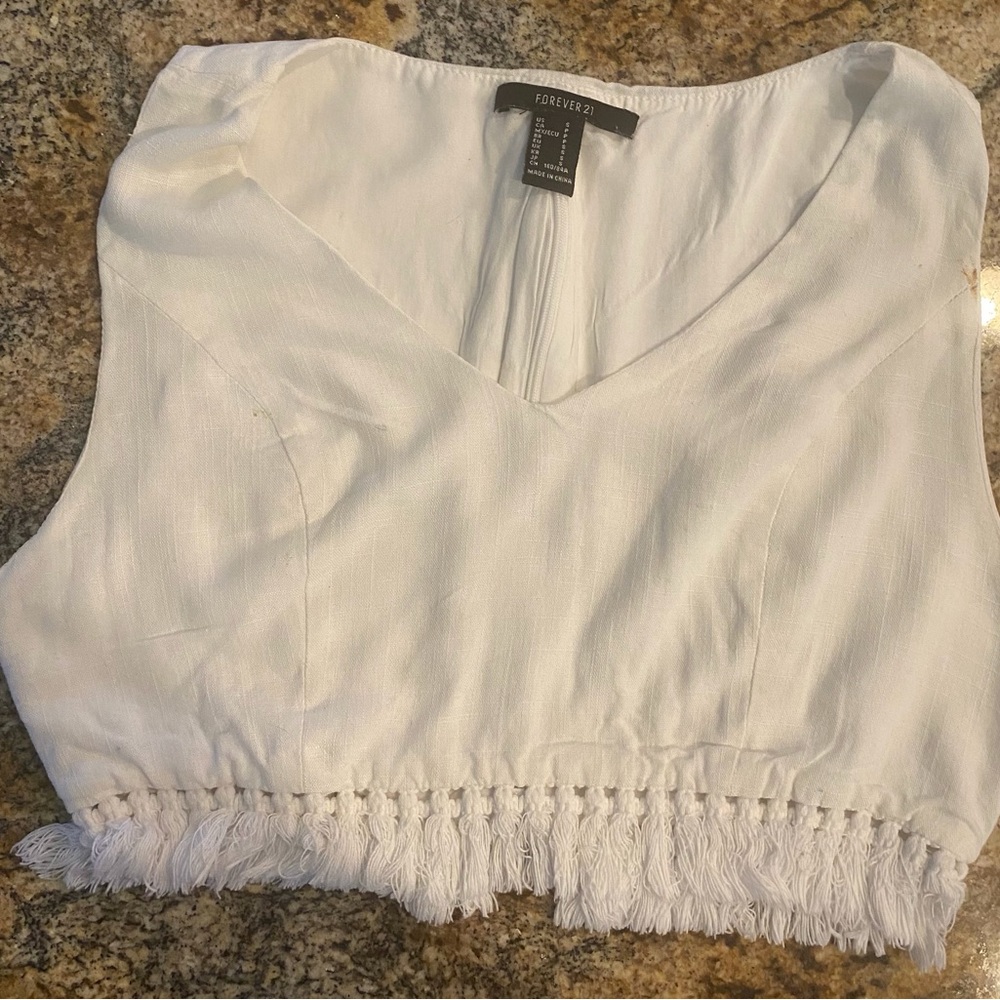 White V Neck Forever 21 Crop Top w/Fringe Bottom. Lined with back zipper.sz sm